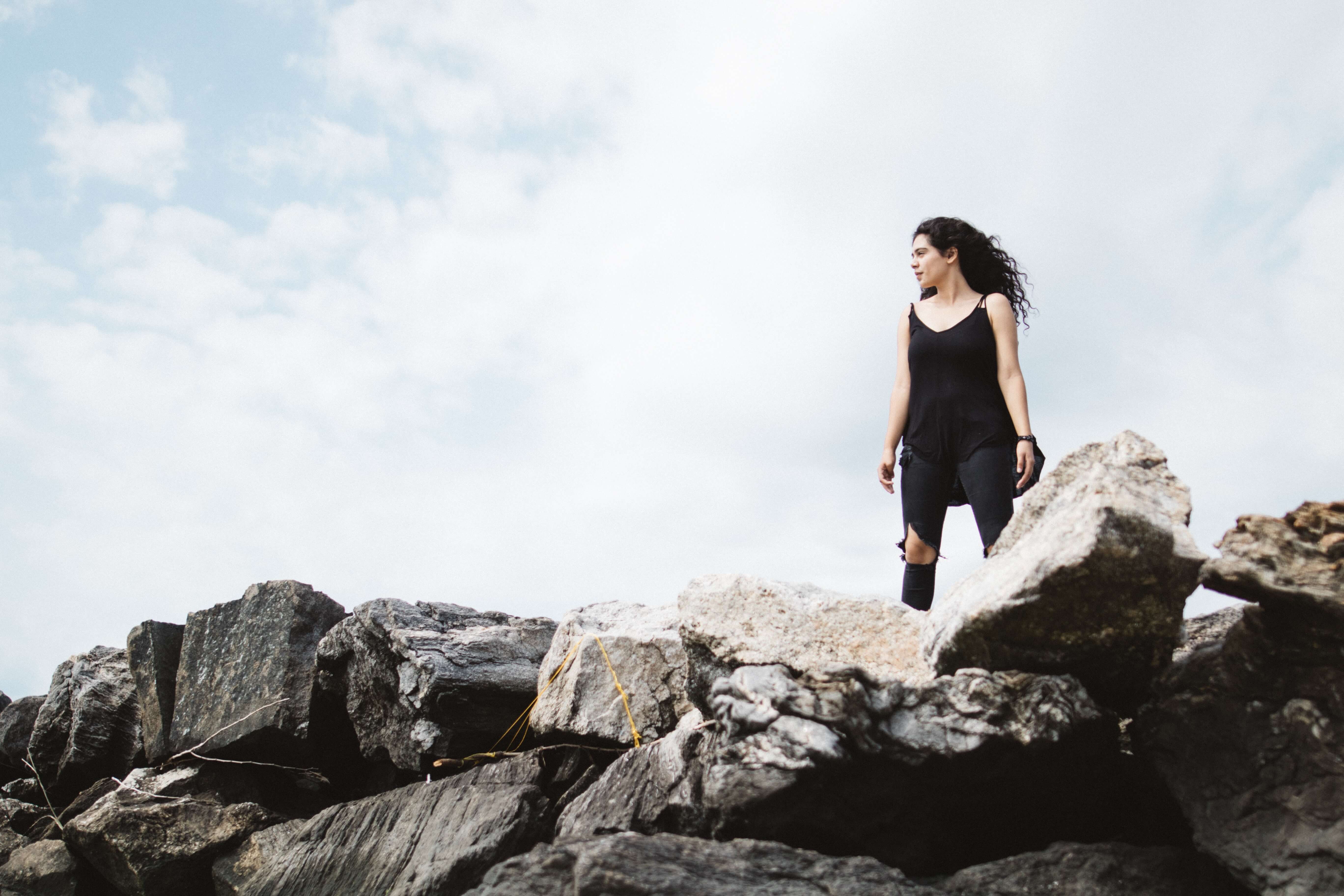 powerful woman on rocks